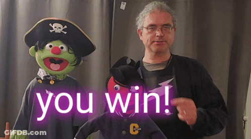 Man Standing Next To Pirate Puppet Saying You Win GIF