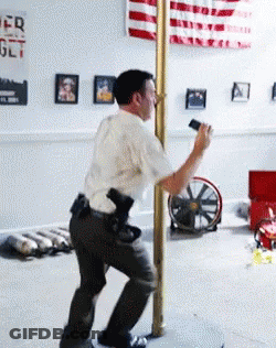 Man Standing Next To Pole With American Flag And Get Poster GIF