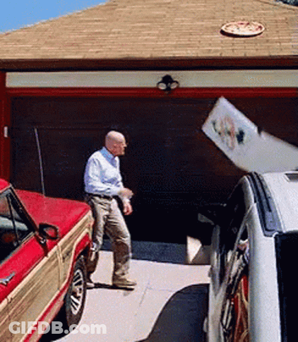 Man Standing Next To Red Truck GIF