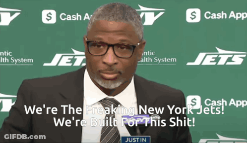 Man Standing Next To Seahawks Logo GIF