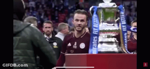 Man Standing Next To Trophy Saying Emirates Fly Better GIF