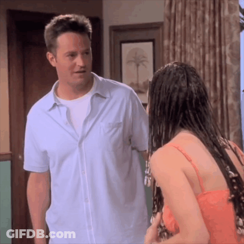 Man Standing Next To Woman With Wet Hair GIF