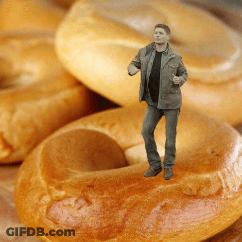 Man Standing On A Bagel In Front Of Bagels GIF