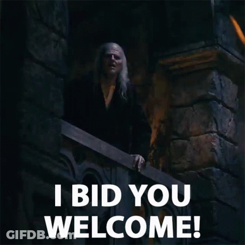 Man Standing On Balcony Saying Welcome GIF