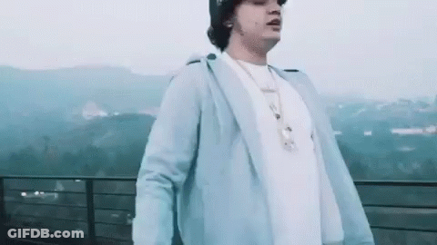 Man Standing On Balcony With Mountains GIF