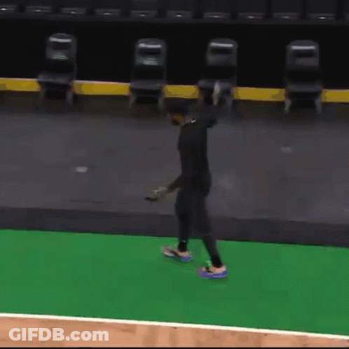 Man Standing On Basketball Court Holding Ball GIF