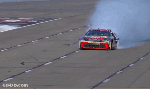 Man Standing On Bass Pro Race Car GIF
