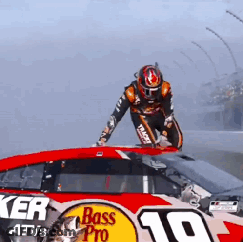 Man Standing On Bass Pro Race Car GIF