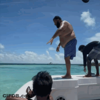 Man Standing On Boat In Ocean GIF