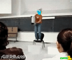 Man Standing On Chair In Front Of Blackboard With Funnyshare.org GIF