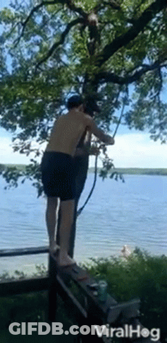 Man Standing On Dock Holding Rope GIF