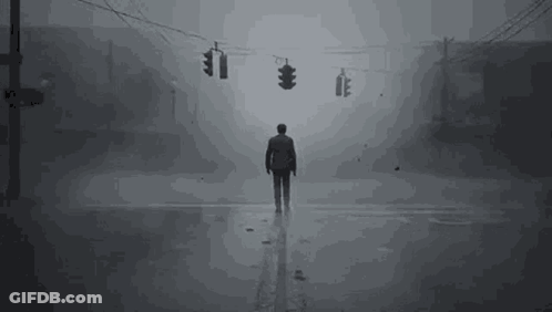 Man Standing On Foggy Street GIF
