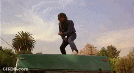 Man Standing On Green Van GIF