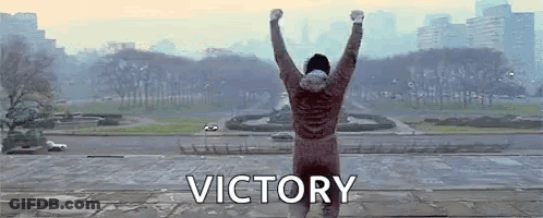 Man Standing On Ledge With Victory GIF