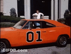 Man Standing On Orange Car Number 01 GIF