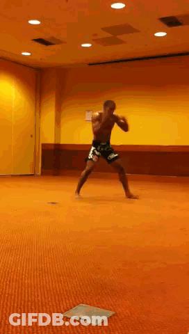 Man Standing On Orange Carpet In Room GIF