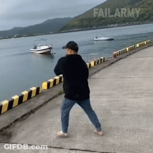 Man Standing On Pier Near Water GIF