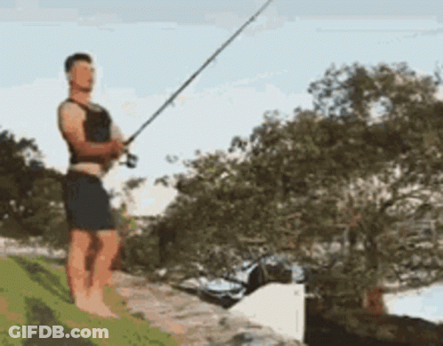 Man Standing On Rock Fishing GIF