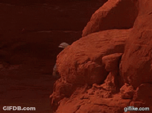 Man Standing On Rock Giflike.com GIF