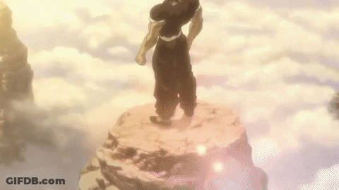 Man Standing On Rock Surrounded By Clouds GIF