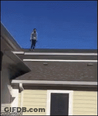 Man Standing On Roof Of House GIF