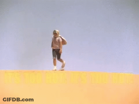 Man Standing On Sand Dune Saying It's Too Hot GIF