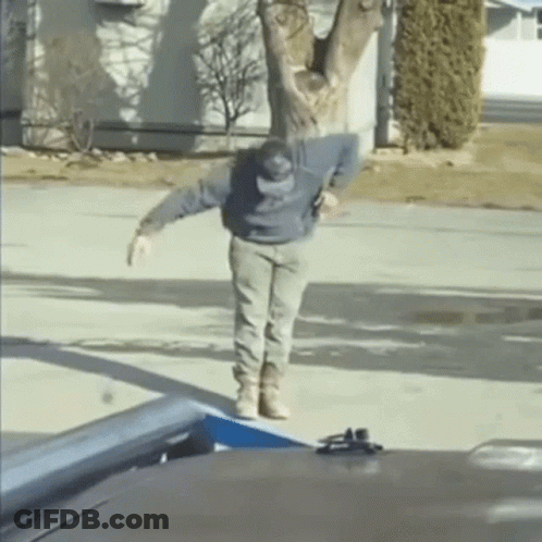 Man Standing On Sidewalk In Front Of House GIF