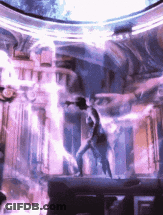 Man Standing On Stage With Purple Light GIF