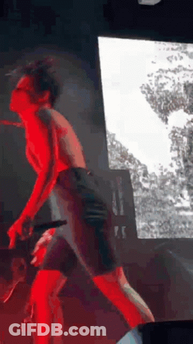 Man Standing On Stage Without Shirt GIF