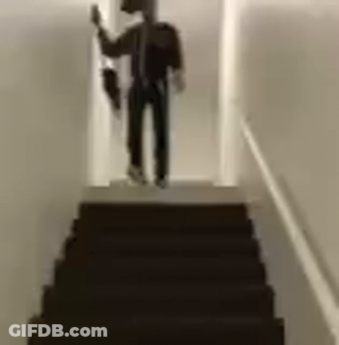 Man Standing On Stairs Holding Umbrella GIF