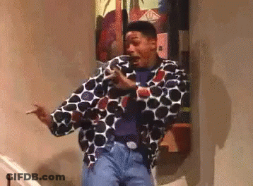 Man Standing On Stairs In Polka Dot Jacket GIF