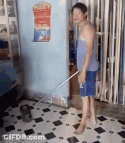 Man Standing On Tiled Floor With Mop GIF