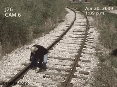 Man Standing On Train Tracks April 20 2009 GIF