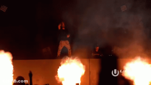 Man Standing On Wall With Fire GIF
