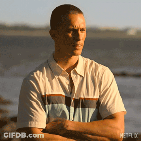 Man Standing With Arms Crossed In Front Of Ocean GIF