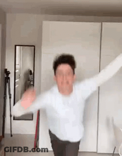 Man Standing With Arms Outstretched GIF