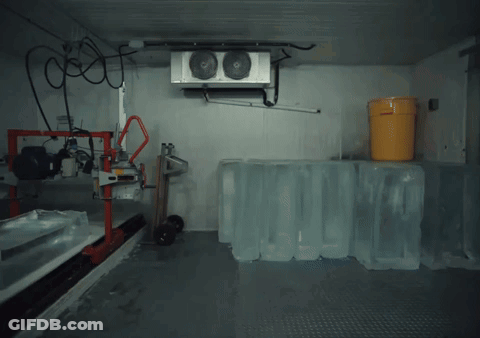 Man Standing With Ice Cubes And Cooler GIF