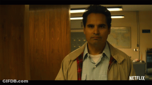 Man Standing With Netflix Logo GIF