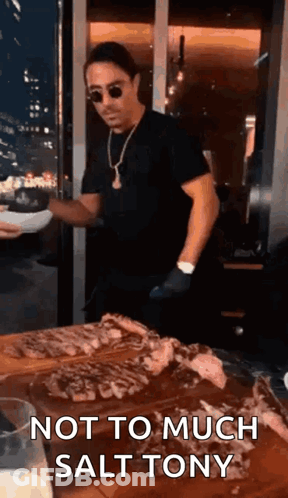 Man Standing With Plate And Meat GIF