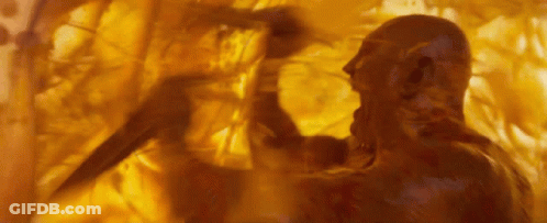 Man Standing With Yellow Painting On Wall GIF