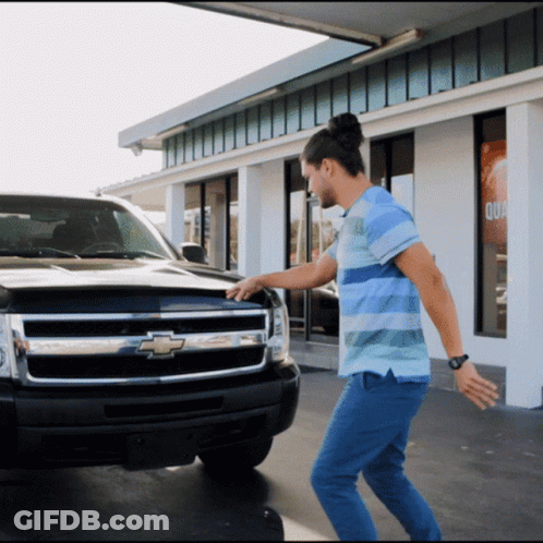 Man Stands In Front Of Chevrolet Truck GIF