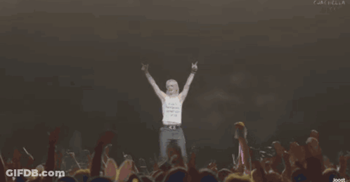 Man Stands In Front Of Crowd With Word Dios GIF