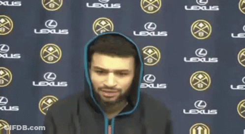 Man Stands In Front Of Lexus Banner GIF