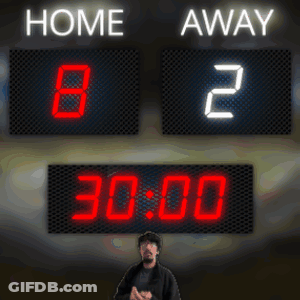Man Stands In Front Of Scoreboard GIF
