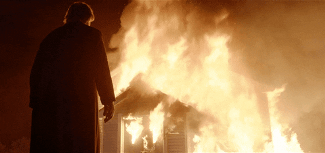 Man Staring At Blazing Fire GIF