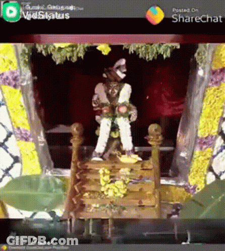 Man Statue On Wooden Temple Staircase GIF