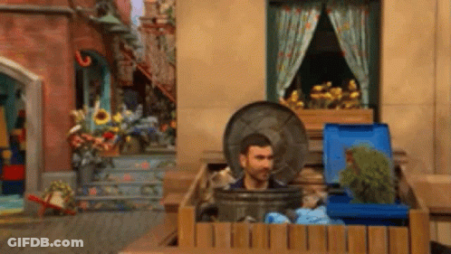 Man Sticking Head Out Of Trashcan GIF