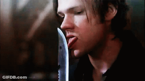 Man Sticking Out Tongue Holding Knife GIF