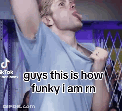 Man Sticking Tongue Out In Blue Shirt GIF