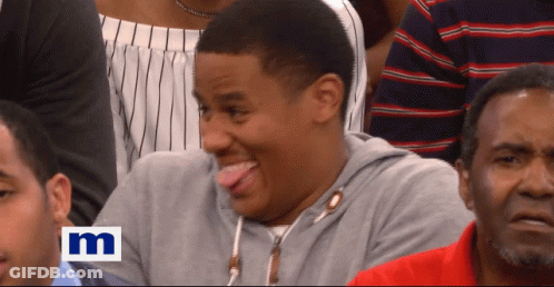 Man Sticking Tongue Out In Crowd GIF